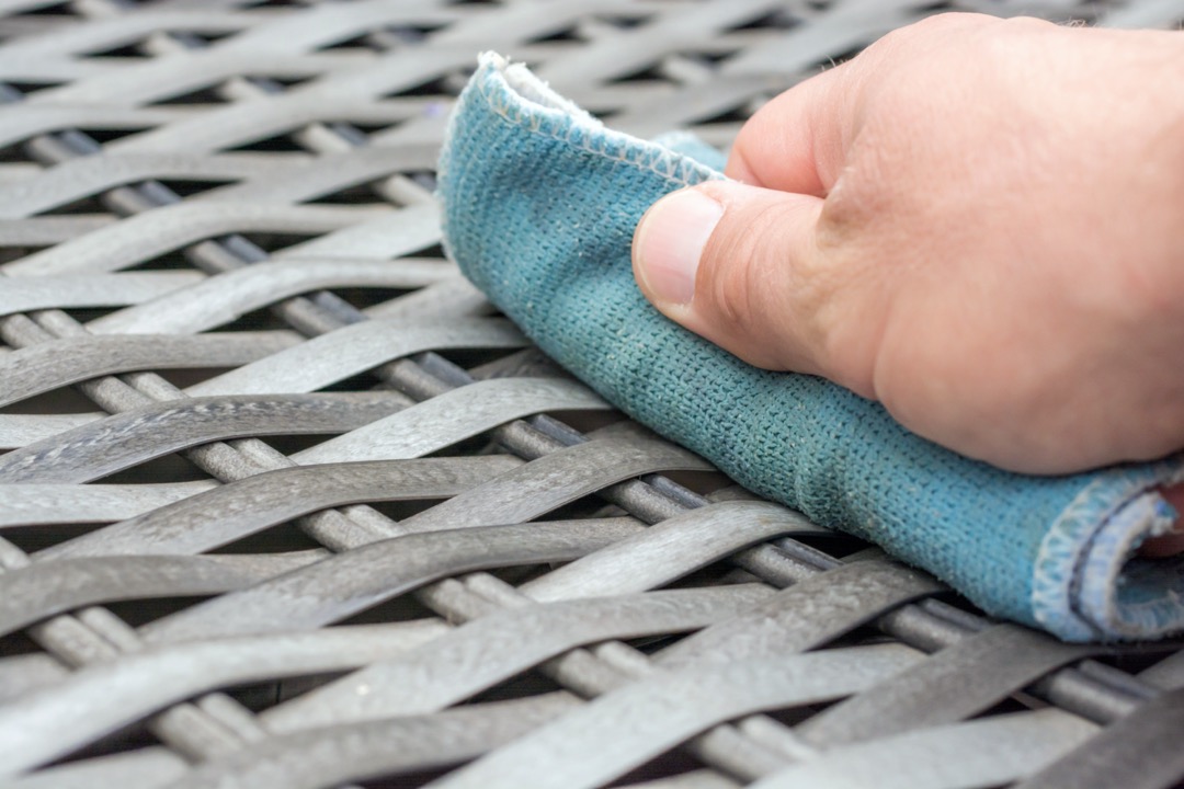 Cleaning patio table before storing it